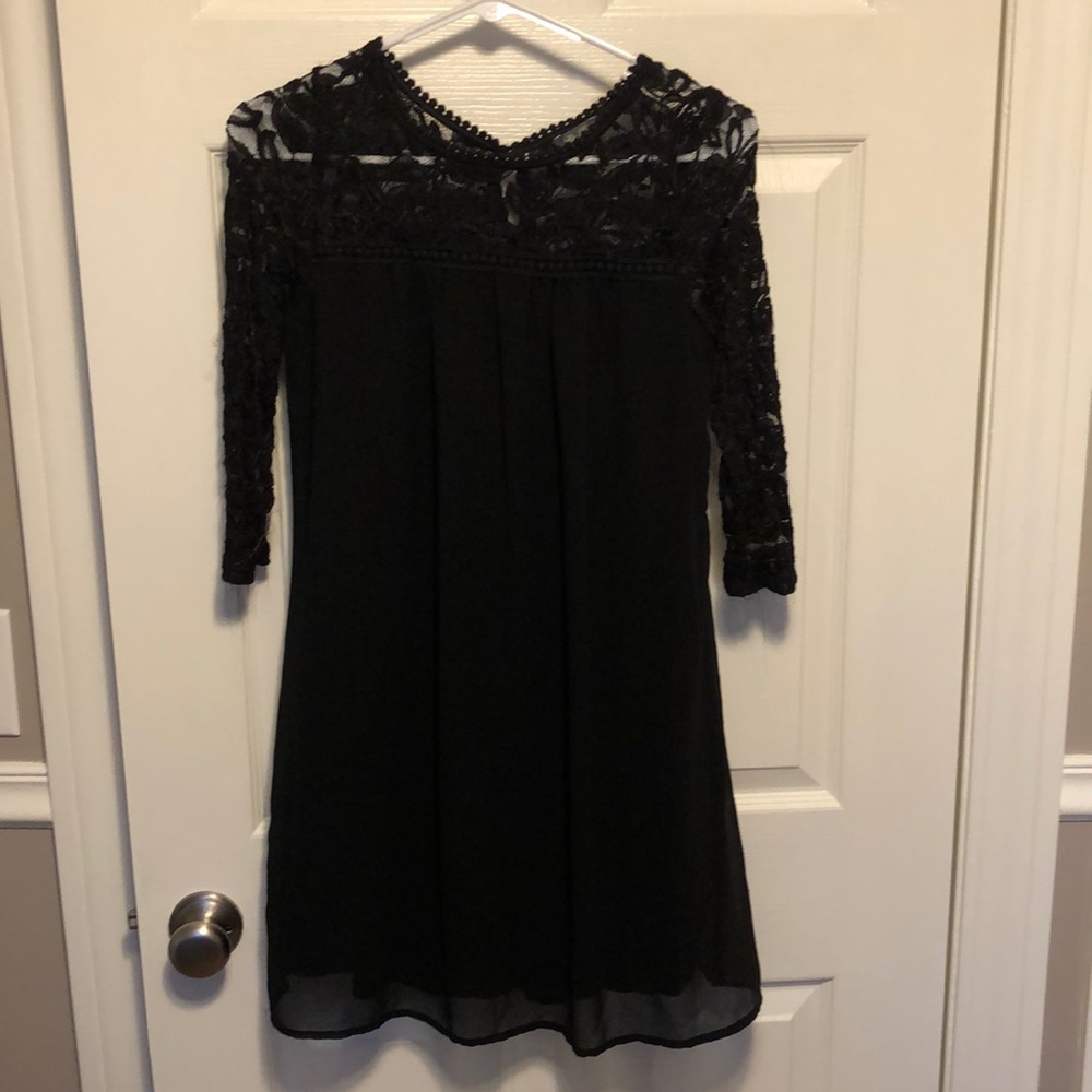 Long sleeve black dress.